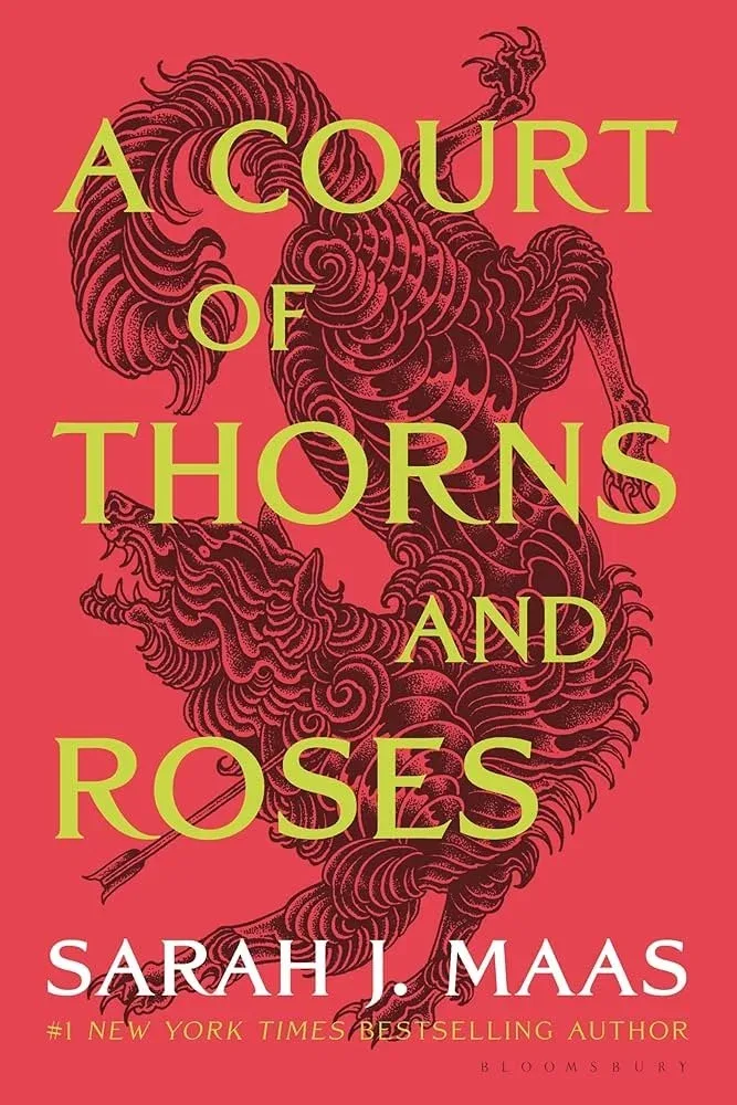 Book cover of A Court of Thorns and Roses by Sarah J. Maas, with a red-and-gold beast illustration.